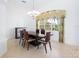 Elegant dining room with dark wood table and chandelier at 12317 Baypointe Ter, Cortez, FL 34215