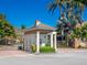 Elegant gated entrance to Harbour Landings Estates, featuring a charming guardhouse at 12317 Baypointe Ter, Cortez, FL 34215