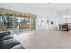 Spacious living room with sliding glass doors to the lanai at 12317 Baypointe Ter, Cortez, FL 34215