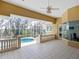 Spacious pool patio with tiled flooring, overlooking a refreshing pool and lush greenery at 12317 Baypointe Ter, Cortez, FL 34215