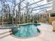 Enjoy this freeform pool and spa with a screened enclosure at 12317 Baypointe Ter, Cortez, FL 34215