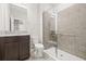 Bathroom with granite vanity and a walk-in shower at 12556 Ryegrass Loop, Parrish, FL 34219