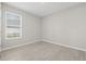 Simple bedroom with wood-look floors and a window at 12556 Ryegrass Loop, Parrish, FL 34219
