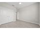 Spacious bedroom featuring wood-look floors and double doors at 12556 Ryegrass Loop, Parrish, FL 34219