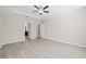 Bright bedroom with wood-look flooring and ceiling fan at 12556 Ryegrass Loop, Parrish, FL 34219