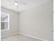 Bright bedroom with wood-look floors and ceiling fan at 12556 Ryegrass Loop, Parrish, FL 34219