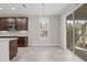Bright dining area with chandelier and sliding glass doors at 12556 Ryegrass Loop, Parrish, FL 34219