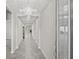 Bright entryway with tile flooring and chandelier at 12556 Ryegrass Loop, Parrish, FL 34219