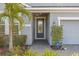 Front entrance with a walkway and landscaping at 12556 Ryegrass Loop, Parrish, FL 34219