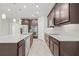 Modern kitchen with stainless steel appliances and granite countertops at 12556 Ryegrass Loop, Parrish, FL 34219