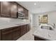 Modern kitchen with stainless steel appliances and granite countertops at 12556 Ryegrass Loop, Parrish, FL 34219