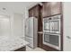 Modern kitchen with stainless steel appliances and granite countertops at 12556 Ryegrass Loop, Parrish, FL 34219