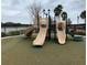 Community playground with slides and climbing structures at 12556 Ryegrass Loop, Parrish, FL 34219