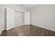Spacious spare bedroom with wood-look flooring and double doors at 12556 Ryegrass Loop, Parrish, FL 34219