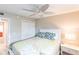 Comfortable bedroom with ceiling fan and floral bedding at 145 Avenida Messina # 3, Sarasota, FL 34242