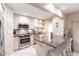 Updated kitchen with stainless steel appliances, breakfast bar, and stylish backsplash at 145 Avenida Messina # 3, Sarasota, FL 34242