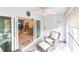 Sunroom with sliding doors leading to kitchen at 145 Avenida Messina # 3, Sarasota, FL 34242