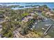 Aerial view of waterfront community with marina and lush landscaping at 1701 Pelican Cove Rd # 359, Sarasota, FL 34231
