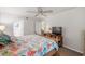 Bedroom with king bed, coastal bedding, and TV at 1701 Pelican Cove Rd # 359, Sarasota, FL 34231
