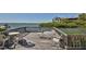 Private deck overlooking the water with seating for relaxing at 1701 Pelican Cove Rd # 359, Sarasota, FL 34231