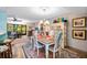 Charming dining room with antique table and hutch at 1701 Pelican Cove Rd # 359, Sarasota, FL 34231