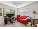 Bright home office features built-in shelving, desk, and comfortable seating at 1701 Pelican Cove Rd # 359, Sarasota, FL 34231
