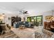 Spacious living room with sectional sofa and access to patio at 1701 Pelican Cove Rd # 359, Sarasota, FL 34231