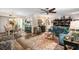 Open living space with sectional sofa and view of dining area at 1701 Pelican Cove Rd # 359, Sarasota, FL 34231