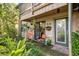 Cozy patio with seating and tropical plants at 1701 Pelican Cove Rd # 359, Sarasota, FL 34231