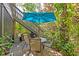 Private patio with table and chairs, perfect for outdoor dining at 1701 Pelican Cove Rd # 359, Sarasota, FL 34231