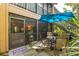 Relaxing patio with seating area and view of the surrounding greenery at 1701 Pelican Cove Rd # 359, Sarasota, FL 34231