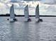 Three sailboats on the water near the community at 1701 Pelican Cove Rd # 359, Sarasota, FL 34231
