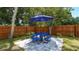 Private patio with blue table and umbrella at 1762 10Th St, Sarasota, FL 34236