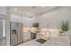 Modern kitchen with stainless steel appliances and white cabinets at 1774 10Th St, Sarasota, FL 34236