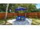 Private patio with blue table and umbrella at 1778 10Th St, Sarasota, FL 34236