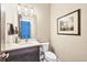 Stylish powder room with dark vanity and elegant decor at 18096 Home Run Dr, Venice, FL 34293