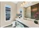 Modern bathroom with quartz countertop and updated fixtures at 18096 Home Run Dr, Venice, FL 34293