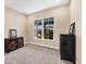 Bright bedroom with ample natural light and carpet flooring at 18096 Home Run Dr, Venice, FL 34293