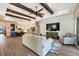 Living room with hardwood floors, exposed beams, and access to a patio at 18096 Home Run Dr, Venice, FL 34293