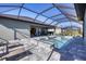 Screened pool and spa with patio and lounge chairs at 18096 Home Run Dr, Venice, FL 34293