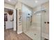 Walk-in shower with glass enclosure and herringbone tile at 18096 Home Run Dr, Venice, FL 34293