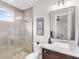 Bathroom with walk-in shower, toilet, and modern vanity at 19458 Beacon Park Pl, Lakewood Ranch, FL 34202