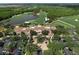 Aerial view of the Clubhouse at the Concession Golf Course with parking and putting green at 19458 Beacon Park Pl, Lakewood Ranch, FL 34202
