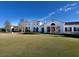 The Concession clubhouse features a classic design and expansive lawn at 19458 Beacon Park Pl, Lakewood Ranch, FL 34202