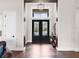 Elegant entryway with double doors and hardwood floors at 19458 Beacon Park Pl, Lakewood Ranch, FL 34202