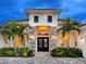 Inviting entryway with a statement door and stone accents at 19458 Beacon Park Pl, Lakewood Ranch, FL 34202