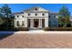 Elegant two-story home with columns and red tile roof at 19458 Beacon Park Pl, Lakewood Ranch, FL 34202