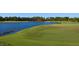 Picturesque golf course with a tranquil lake and well-manicured greens at 19458 Beacon Park Pl, Lakewood Ranch, FL 34202