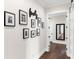 Bright hallway with Gathering photos and a full-length mirror at 19458 Beacon Park Pl, Lakewood Ranch, FL 34202