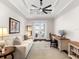 Home office with comfortable seating and built-in workspace at 19458 Beacon Park Pl, Lakewood Ranch, FL 34202